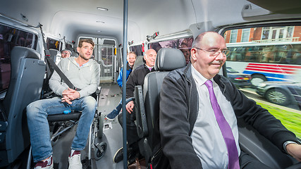 Image showing Group of people, travelling in a minivan with a busdriver and di