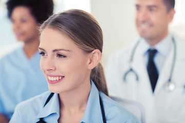 Image showing happy doctor over group of medics at hospital