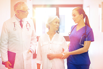 Image showing medics and senior patient woman at hospital