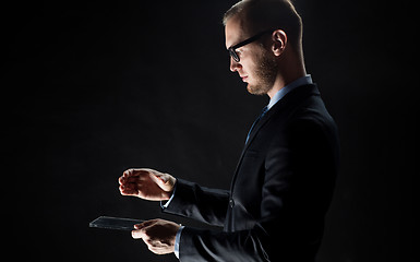 Image showing close up of businessman with transparent tablet pc