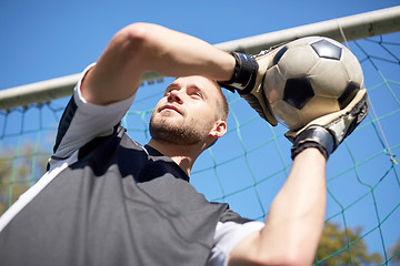 Image showing goalkeeper with ball at football goal on field