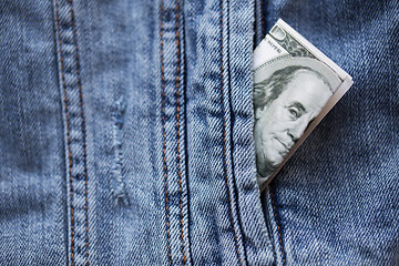 Image showing dollar money in pocket of denim jacket