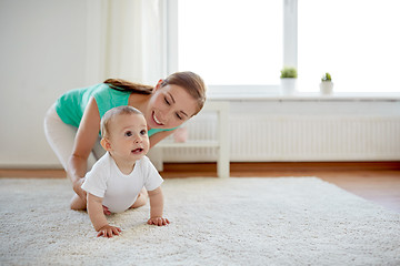 Image showing happy mother playing with baby at home