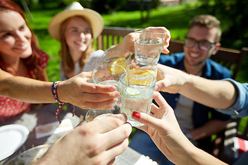 Image showing happy friends with drinks at summer garden party