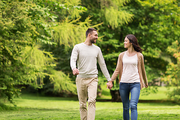 Image showing happy couple walking in summer park