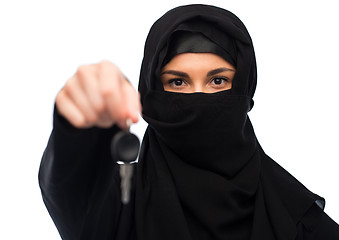 Image showing muslim woman in hijab with car key over white