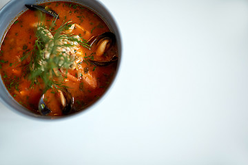 Image showing seafood soup with fish and blue mussels in bowl