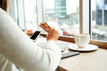 Image showing woman with smartphone and sandwich at restaurant