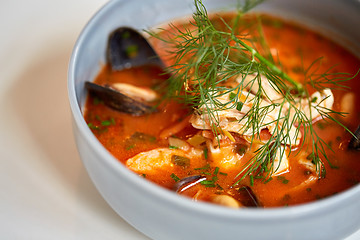 Image showing close up of seafood soup with fish and mussels