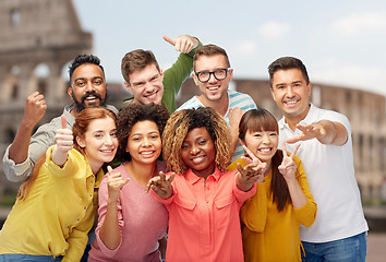 Image showing international people showing thumbs up at coliseum