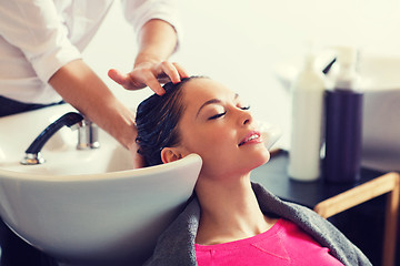 Image showing happy young woman at hair salon