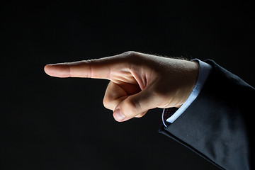 Image showing close up of hand pointing finger to something
