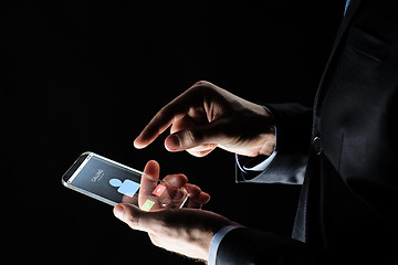 Image showing close up of hands with incoming call on smartphone