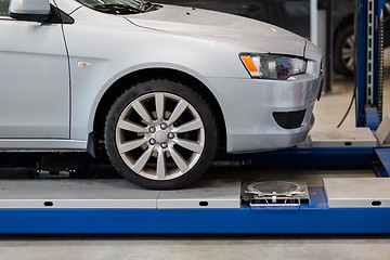 Image showing car on lift at repair station