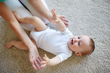 Image showing happy mother playing with baby at home