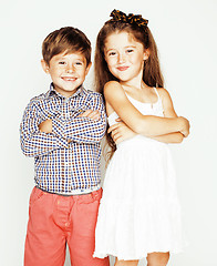 Image showing little cute boy and girl hugging playing on white background, happy smiling family, lifestyle people concept 