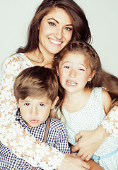 Image showing two pretty children kissing their mother happy smiling close up, happy family, brother and sister, lifestyle people concept