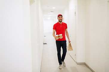 Image showing man delivering coffee and food to customer home