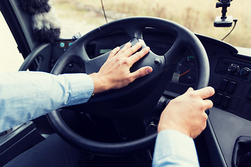 Image showing close up of driver driving passenger bus