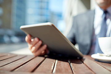 Image showing businessman with tablet pc and coffee outdoors