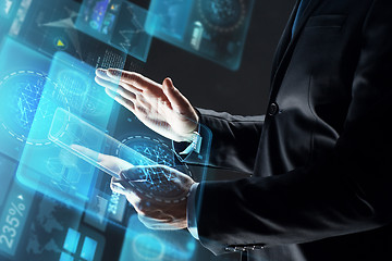 Image showing close up of businessman with transparent tablet pc