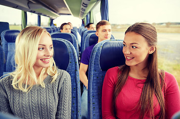 Image showing happy young women talking in travel bus