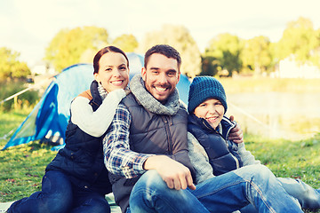 Image showing happy family with tent at camp site