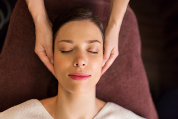 Image showing woman having face and head massage at spa