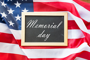 Image showing memorial day words on chalkboard and american flag