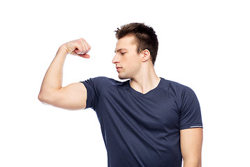 Image showing sportive man showing bicep power