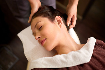 Image showing woman having head massage at spa