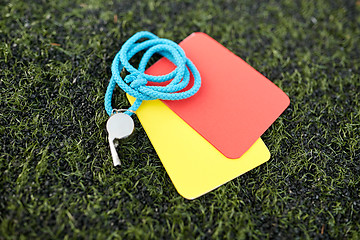 Image showing whistle and caution cards on football field