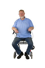 Image showing Satisfied senior sitting on walker
