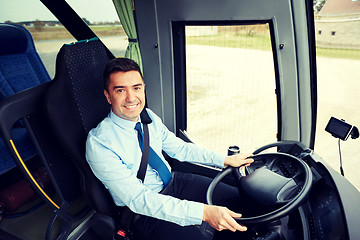 Image showing happy driver driving intercity bus