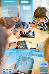 Image showing group of school kids with tablet pc in classroom