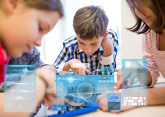 Image showing group of school kids with tablet pc in classroom