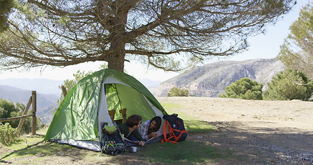 Image showing Romantic couple taking rest in tent