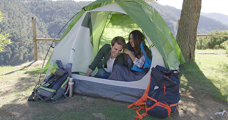 Image showing Smiling couple having fun in tent