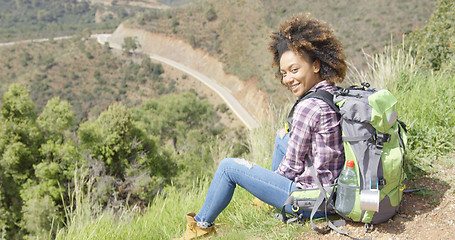 Image showing Beautiful female traveler on mountain