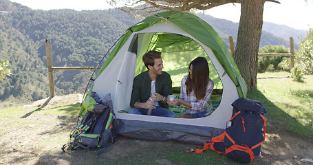 Image showing Two people having rest in tent