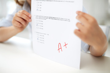 Image showing girl with test paper at school