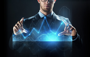 Image showing close up of businessman with virtual diagram