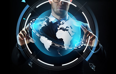 Image showing close up of businessman with earth projection