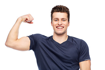 Image showing sportive man showing bicep power