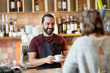 Image showing man or waiter serving customer in coffee shop