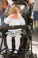 Image showing baby girl sitting in the pram