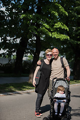 Image showing couple with baby pram in summer park