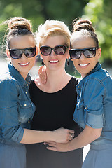 Image showing portrait of three young beautiful woman with sunglasses