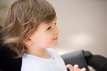 Image showing baby girl sitting in the pram