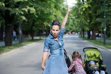 Image showing mother with her daughters in the park